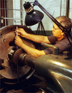 Sudol measuring a piece of equipment