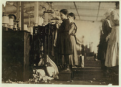 This little girl like many others in this state is so small she has to stand on a box to reach her machine ...  Location: Loudon, Tennessee (LOC)