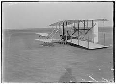 [Wilbur in prone position in damaged machine, on ground after unsuccessful trial of December 14, 1903, Kitty Hawk, North Carolina] (LOC)
