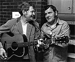 Dean and Gene Reed with a guitar