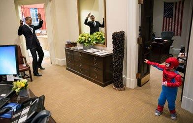 Photo: Barack Obama knows how to have some fun in front of the camera, and this picture of the president pretending to be nabbed by a pint-sized Spider-Man quickly goes viral.

Is this the cutest Obama photo you've ever seen? http://yhoo.it/UEokD0