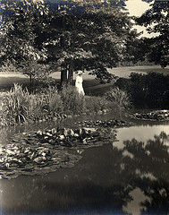 Elisabeth Severance Allen Prentiss standing next to a pond at Glenallen (1915-1945)