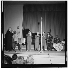 [Portrait of Jack Teagarden, Dick Carey, Louis Armstrong, Bobby Hackett, Peanuts Hucko, Bob Haggart, and Sid Catlett, Town Hall, New York, N.Y., ca. July 1947] (LOC)