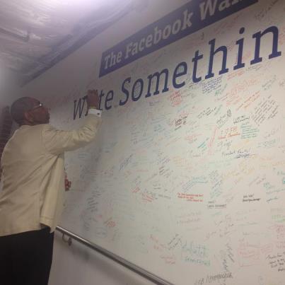 Photo: Congressman Bobby L. Rush, D-Ill., signs the Facebook Washington DC wall after meeting with our public policy team.