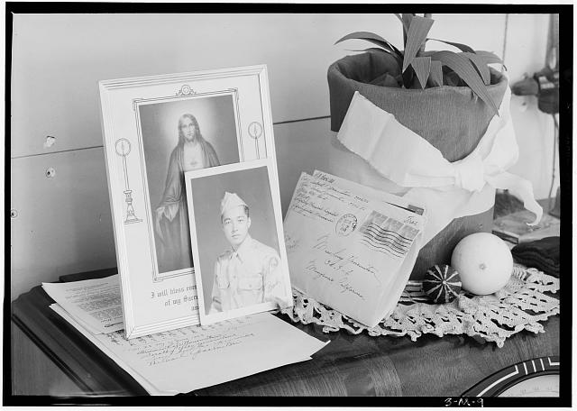 Pictures and mementoes on phonograph top: Yonemitsu home, Manzanar Relocation Center