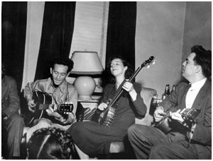 Sonny Terry (obscured), Woody Guthrie, Lilly Mae Ledford, Alan Lomax, New York, 1944. Photographer unknown.