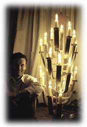 Charles Eames with Christmas Tree made from molded plywood chair legs.