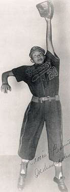 Mamie "Peanut" Johnson in her Clowns uniform, catching a ball