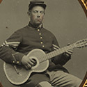 Edwin Chamberlain of 11th New Hampshire Infantry Regiment with guitar