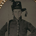 Young soldier in Union uniform and Hardee hat with bayoneted musket