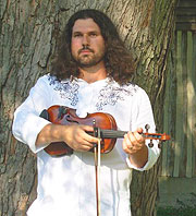 Dennis Stroughmatt with fiddle.