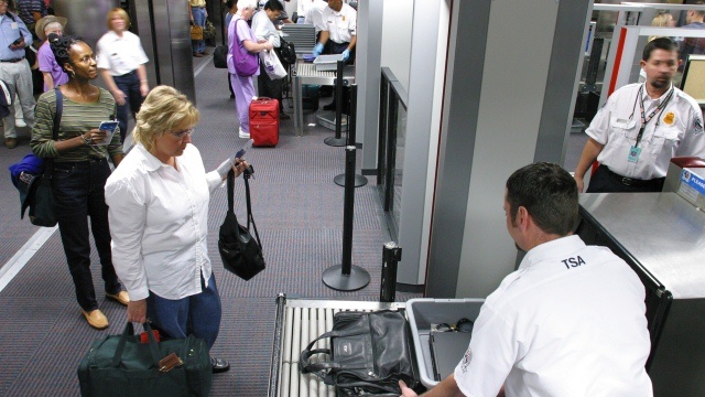 Airport Traveler at Security Checkpoint