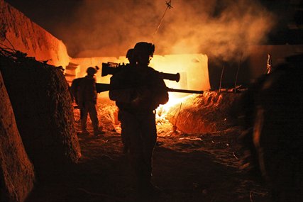 U.S. Marines exit a compound in Agha Ahmad in Afghanistan's Helmand province, Aug. 27, 2012. The Marines are assigned to Scout Sniper Platoon, Alpha Company, 1st Battalion, 1st Marines, Regimental Combat Team 6.
