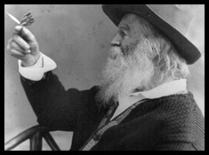 Walt Whitman holding a butterfly on his finger.