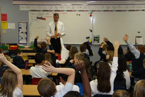 Paulsen visits with students at Parnassus Academy in Maple Grove