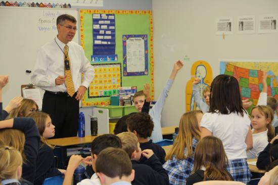 Paulsen visits with students at Parnassus Academy in Maple Grove