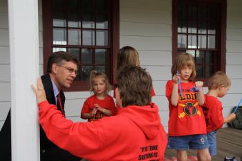 Rep. Paulsen speaks with a Maple Grove family before their father deploys for his third tour of duty