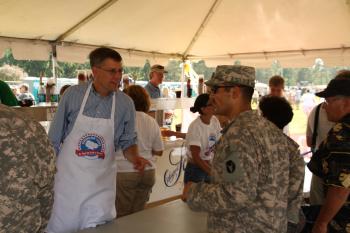 Rep. Paulsen serves dinner to 2,400 MN Army National Guard soldiers before their deployment to Kuwait