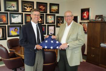 Rep. Paulsen presents Lifetouch Inc. with a flag flown over the U.S. Capitol, celebrating the companies 75th anniversary. 