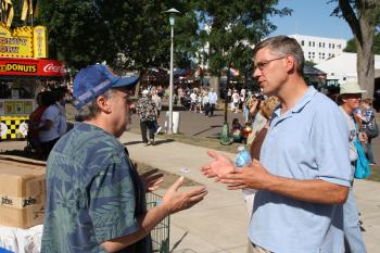 Rep. Paulsen speaks with fairgoers during this year's Great Minnesota Get Together