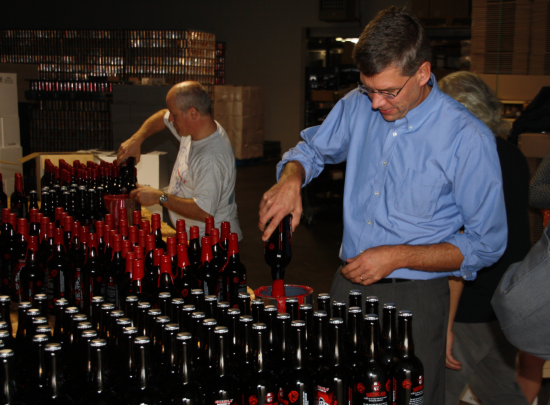 Rep. Paulsen visits local small business Surley Brewery and helps package their new batch of seasonal brews