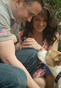 photo of serviceman with wife and dog