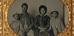 [Unidentified African American soldier in Union uniform with wife and two daughters]
