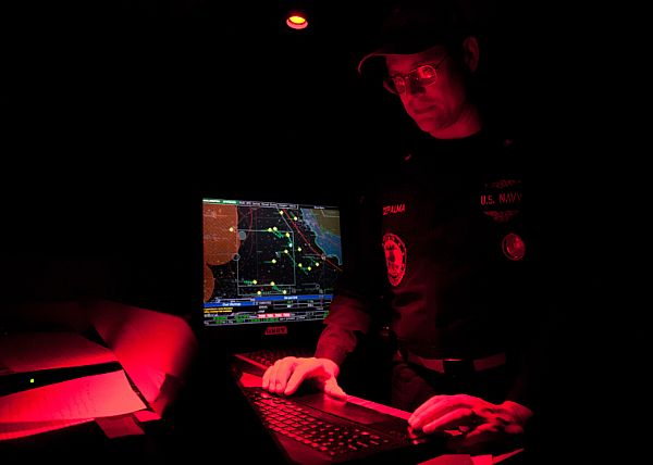 Lt. Cmdr. Charles Depalma, from Elmira, N.Y., types the midnight entry of the new year into the log book in the bridge of the aircraft carrier USS John C. Stennis (CVN 74). John C. Stennis is deployed to the U.S. 5th Fleet area of responsibility conducting maritime security operations, theater security cooperation efforts and support missions for Operation Enduring Freedom.  U.S. Navy photo by Mass Communication Specialist 2nd Class Charlotte C. Oliver (Released)  130101-N-HV737-005