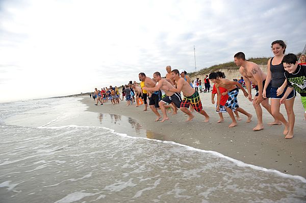 Service members, family and friends celebrate the new year by swimming into the Atlantic Ocean during the Polar Plunge at Naval Station Mayport.  U.S. Navy photo by Mass Communication Specialist 2nd Class Marcus L. Stanley (Released)  130101-N-MJ645-003