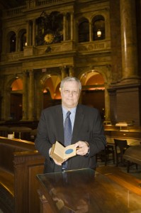 Mark Dimunation, chief of the Library of Congress' Rare Books and Special Collections Division, in the Library's Main Reading Room, holds open the 1861 Lincoln Inaugural Bible to the page signed by the clerk of the Supreme Court, William Thomas Carroll