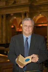 Mark Dimunation, chief of the Library of Congress' Rare Books and Special Collections Division, holds open the 1861 Lincoln Inaugural Bible to the page signed by the clerk of the Supreme Court, William Thomas Carroll