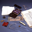 The contents of Lincoln's pockets arranged on a blue cloth.