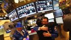 Traders hug on New Year's Eve on the New York Stock Exchange