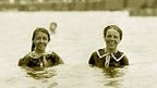 Two girls swimming