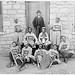 [African American baseball players from Morris Brown College, with boy and another man standing at door, Atlanta, Georgia] (LOC)