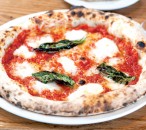 Pizzeria Orso's margherita pizza is topped with tomato sauce, basil and buffalo mozzarella.