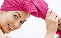Women with hair wrapped in towel
