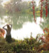 Woman on riverbank in autumn
