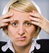 Woman with headache making face
