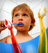 child brushing his teeth