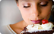 woman smelling cake