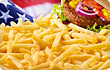 Cascade of fries with stars and stripes in backgro