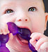 Baby chewing on teething ring