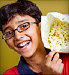 boy holding popcorn