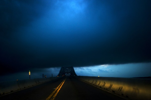 NEWBURG, MD - JUNE 4; Dark clouds cover the sky crossing the Potomac toward Virginia on the Gov. Harry Nice Memorial Bridge (Hwy 301).(Photo by Bonnie Jo Mount/The Washington Post)