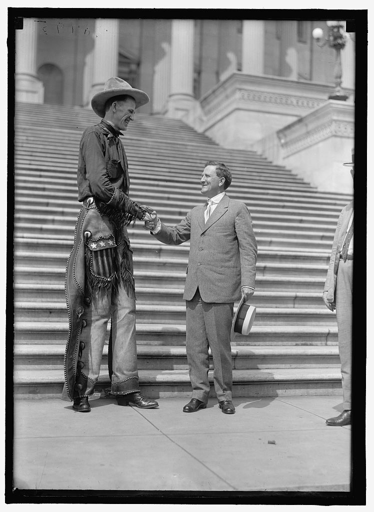 Madsen, Ralph E. The Tall Cowboy. At Capitol, Shaking hands with Senator Morris Sheppard.