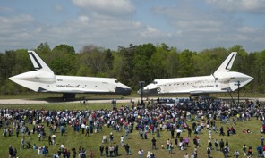 CHANTILLY, VA - APRIL 19:  In this handout provided by Smithsonian Institution, space shuttles Enterprise (L)and Discovery sit nose-to-nose at the beginning of a transfer ceremony at the Smithsonian's Steven F. Udvar-Hazy Center, April 19, 2012, in Chantilly, Virginia. Enterprise, which is being transferred to New York City, is being replaced by the space shuttle Discovery at the museum. (Photo by /Carolyn Russo/Smithsonian Institution via Getty Images)