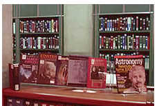 Photo: Shelves of books, with dispaly of books and magazines  on Einstien in the foreground.