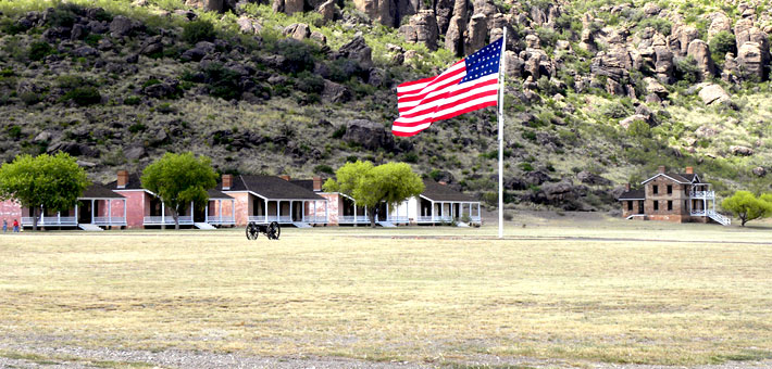 Photo of officers' row at Fort Davis with the Davis Mountains in the background