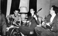 Sonny Terry, Woody Guthrie, Elizabeth Lomax, and Alan Lomax play and sing folk music